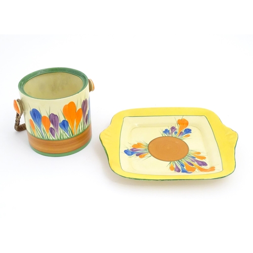 73 - A Clarice Cliff sandwich plate decorated in the Crocus pattern. Together with a Clarice Cliff biscui... 