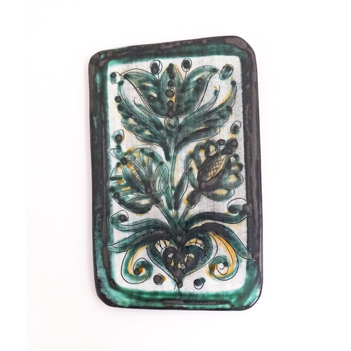 89 - A studio pottery tile by Burkart Handarbeit, with floral and foliate detail. Signed to reverse. Appr... 