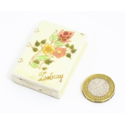 107 - A Hungarian Zsolnay Pecs model of a book decorated with flowers. Marked under. Approx. 1/2