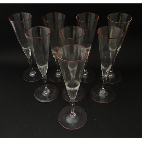 241 - Salviati & Co. Glassware: Eight Venetian glass champagne flutes with pink detail to rims. Approx. 8