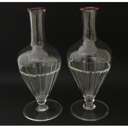 243 - Salviati & Co. Glassware: Two Venetian glass carafes with pink detail to rims. Approx. 11