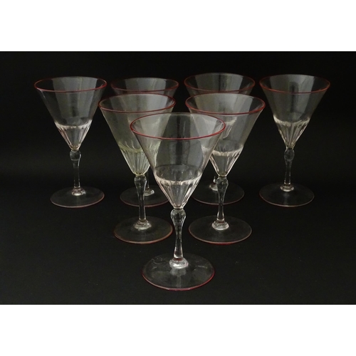 246 - Salviati & Co. Glassware: Seven Venetian glass pedestal drinking glasses with pink detail to rims. A... 