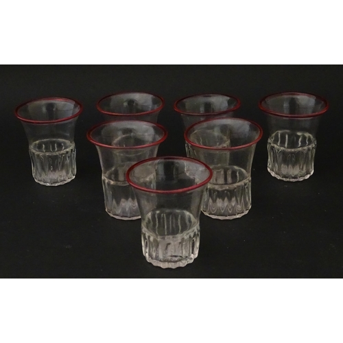 248 - Salviati & Co. Glassware: Seven Venetian glass tot / shot glasses with pink detail to rims. Approx. ... 