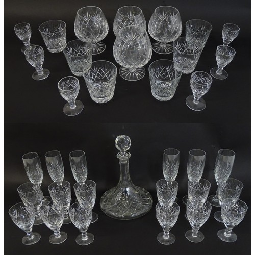 262 - A large quantity of cut glass / crystal glassware to include champagne flutes,  assorted drinking gl... 