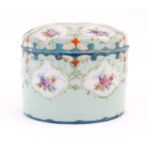 101 - A  Continental pot and cover decorated with hand painted floral vignettes. Approx. 4