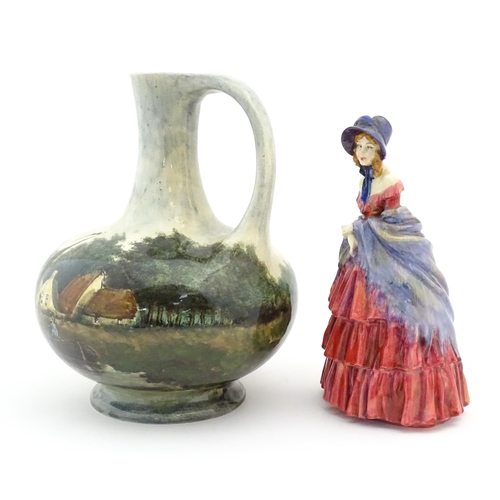 119 - A Royal Doulton figure titled A Victorian Lady no. HN728. Together with a hand painted jug decorated... 