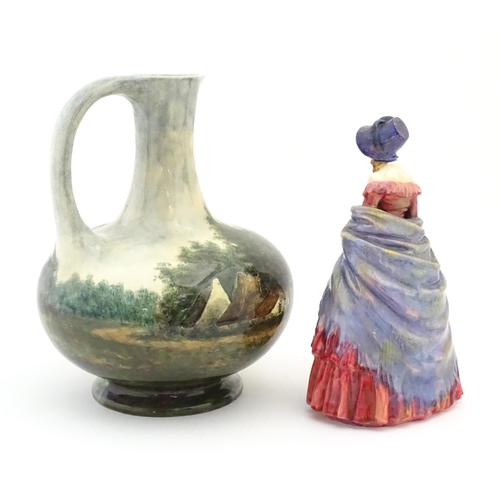 119 - A Royal Doulton figure titled A Victorian Lady no. HN728. Together with a hand painted jug decorated... 