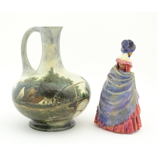 119 - A Royal Doulton figure titled A Victorian Lady no. HN728. Together with a hand painted jug decorated... 