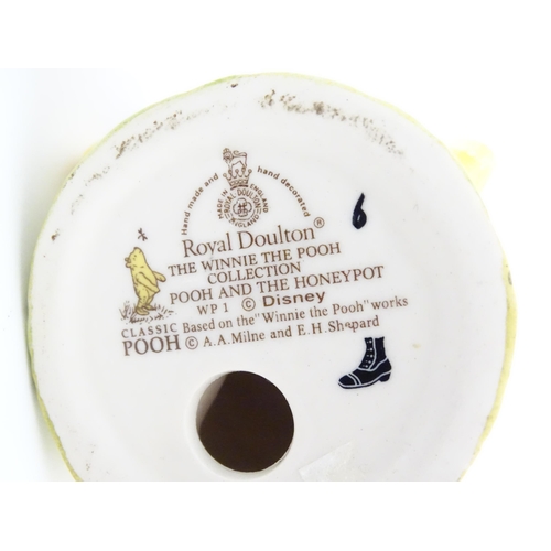 123 - Two Royal Doulton Disney figures comprising Pooh and the Honey Pot WP1, and 101 Dalmatians Rolly DM ... 