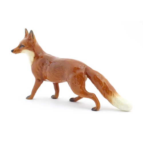 125 - A Beswick model of a standing fox, model no. 1016A. Marked under. Approx. 5