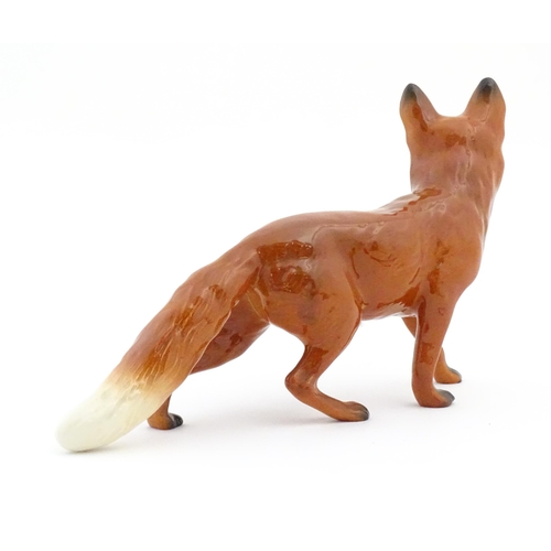 125 - A Beswick model of a standing fox, model no. 1016A. Marked under. Approx. 5