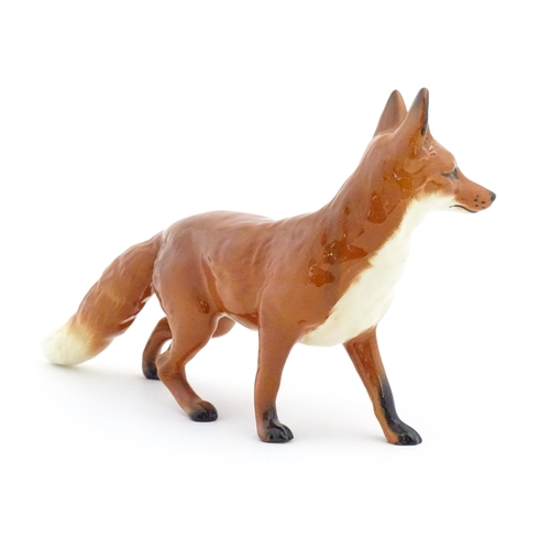 125 - A Beswick model of a standing fox, model no. 1016A. Marked under. Approx. 5