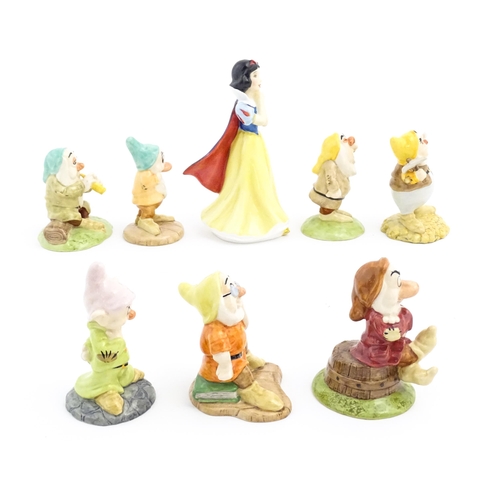 128 - Eight Royal Doulton figures / models comprising Snow White and the Seven Dwarfs, Sleepy, Bashful, Sn... 