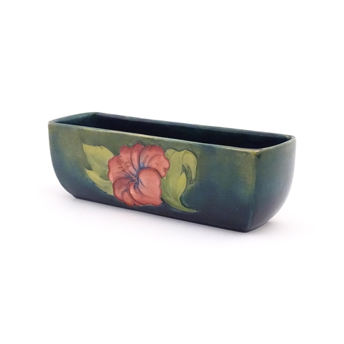 157 - A Moorcroft dish of rectangular form decorated in the Hibiscus pattern. Marked under. Approx. 2 1/2