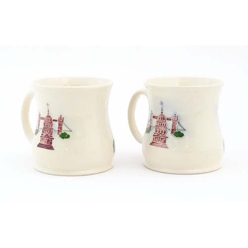 158 - Two commemorative Moorcroft mugs depicting Beaufort House. Marked under Moorcroft Richards Butler Be... 