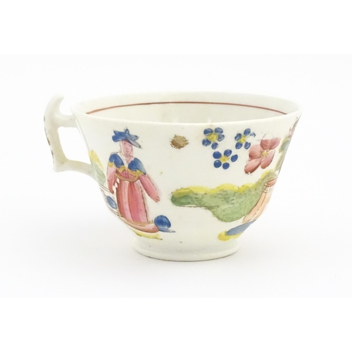 172 - A 19thC tea cup and saucer depicting figures by a fountain with flowers, birds and dog. In the manne... 