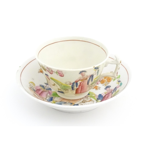 172 - A 19thC tea cup and saucer depicting figures by a fountain with flowers, birds and dog. In the manne... 