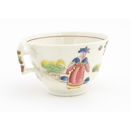 172 - A 19thC tea cup and saucer depicting figures by a fountain with flowers, birds and dog. In the manne... 