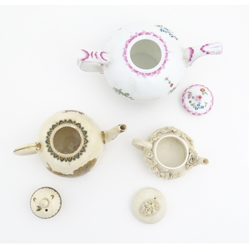 180 - Three miniature / small teapots comprising a bisque miniature teapot with applied flowers, a H M Wil... 