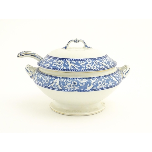 186 - A Wedgwood & Co. blue and white soup tureen and ladle with transfer decoration in
the Hawthorn patte... 