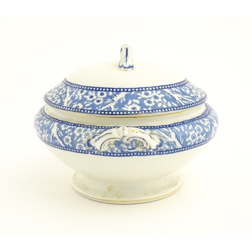 186 - A Wedgwood & Co. blue and white soup tureen and ladle with transfer decoration in
the Hawthorn patte... 