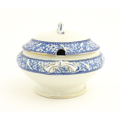 186 - A Wedgwood & Co. blue and white soup tureen and ladle with transfer decoration in
the Hawthorn patte... 