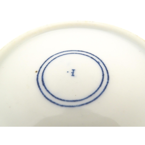 46 - A blue and white tea cup and saucer decorated in the Long Eliza pattern. Together with another tea c... 