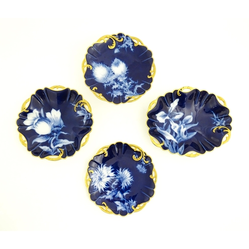 53 - A Haviland Limoges part dessert service with a blue ground and gilt highlights, decorated with Chrys... 