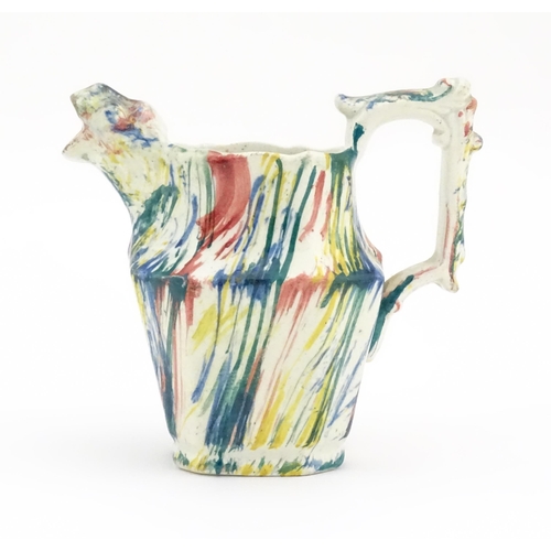 63 - A 19thC small jug with zoomorphic spout decorated in Pratt colours. Approx. 4 1/4