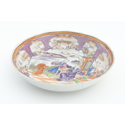 65 - A Miles Mason style tea bowl and saucer in the pattern Boy At Door, depicting Oriental figures in a ... 