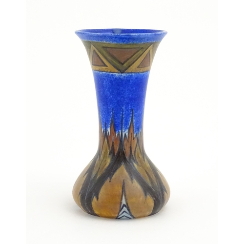 79 - An Art Deco Clews & Co. Chameleon ware vase with flared rim decorated in the Blue Flame pattern. Mar... 