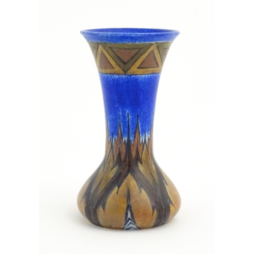 79 - An Art Deco Clews & Co. Chameleon ware vase with flared rim decorated in the Blue Flame pattern. Mar... 