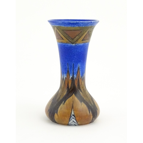 79 - An Art Deco Clews & Co. Chameleon ware vase with flared rim decorated in the Blue Flame pattern. Mar... 