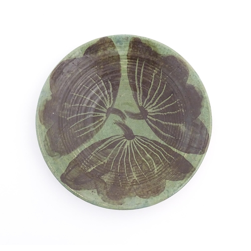 83 - A studio pottery dish by Sybil Finnemore for Yellowsands Pottery with leaf / petal decoration. Bears... 