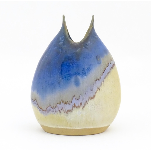 87 - A Greek studio pottery vase by Kamini with asymmetric drip glaze. Impressed marks lower. Approx. 8 1... 