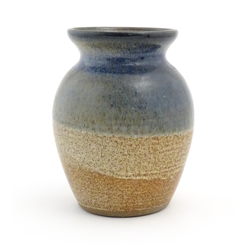 91 - A studio pottery vase of baluster form by Brian Dewbury decorated with three coloured bands. Marked ... 