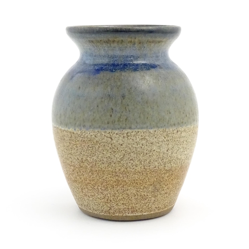 91 - A studio pottery vase of baluster form by Brian Dewbury decorated with three coloured bands. Marked ... 