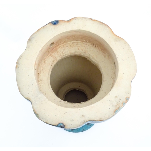 196 - A ceramic jardiniere stand of pedestal form with mottled blue / green glaze. Approx. 20 1/2