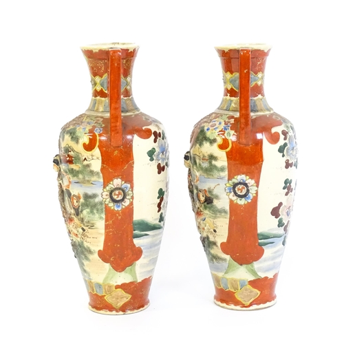 198 - A pair of Japanese satsuma vases with shaped handles, decorated with figures dancing in a landscape,... 