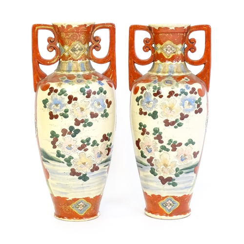 198 - A pair of Japanese satsuma vases with shaped handles, decorated with figures dancing in a landscape,... 