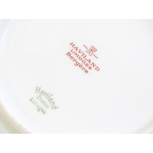 202 - A quantity of Haviland Limoges dinner wares in the Bergere pattern to include plates, serving dishes... 