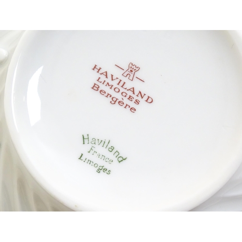 202 - A quantity of Haviland Limoges dinner wares in the Bergere pattern to include plates, serving dishes... 