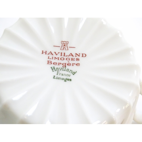 202 - A quantity of Haviland Limoges dinner wares in the Bergere pattern to include plates, serving dishes... 