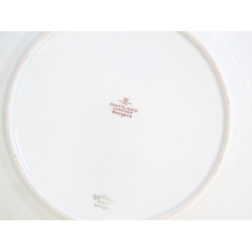 202 - A quantity of Haviland Limoges dinner wares in the Bergere pattern to include plates, serving dishes... 