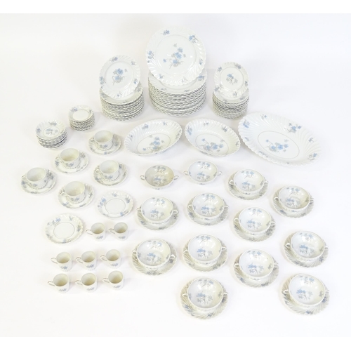 202 - A quantity of Haviland Limoges dinner wares in the Bergere pattern to include plates, serving dishes... 