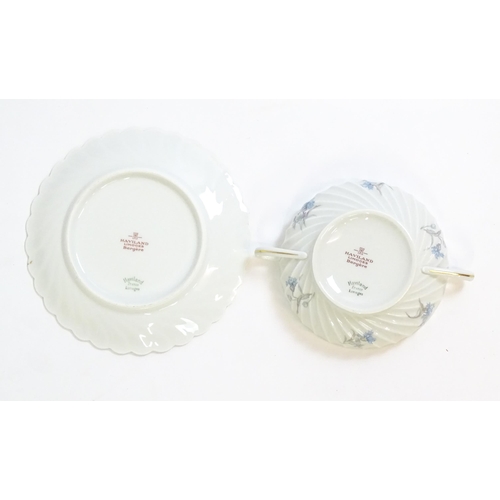 202 - A quantity of Haviland Limoges dinner wares in the Bergere pattern to include plates, serving dishes... 