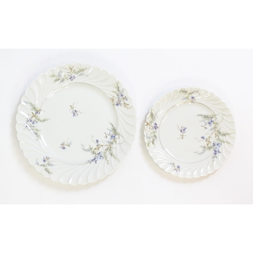 203 - A quantity of Haviland Limoges dinner wares in the Orsay pattern to include plates, serving dishes, ... 