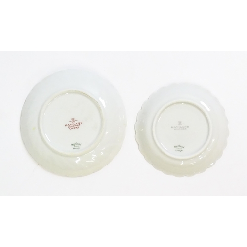 203 - A quantity of Haviland Limoges dinner wares in the Orsay pattern to include plates, serving dishes, ... 