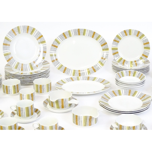 205 - A quantity of Midwinter dinner wares in the Sienna pattern to include plates, serving dishes / turee... 