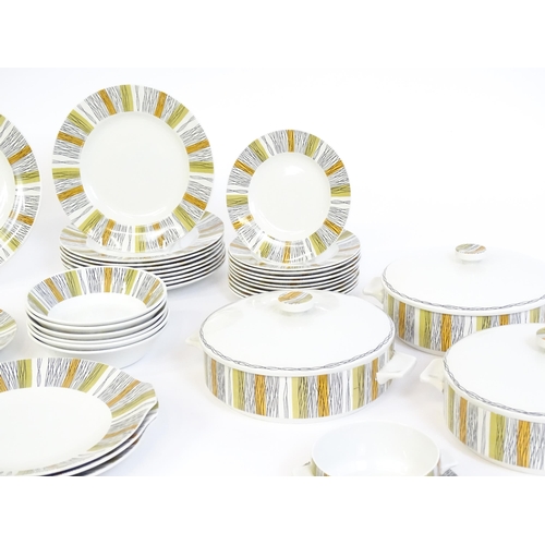 205 - A quantity of Midwinter dinner wares in the Sienna pattern to include plates, serving dishes / turee... 